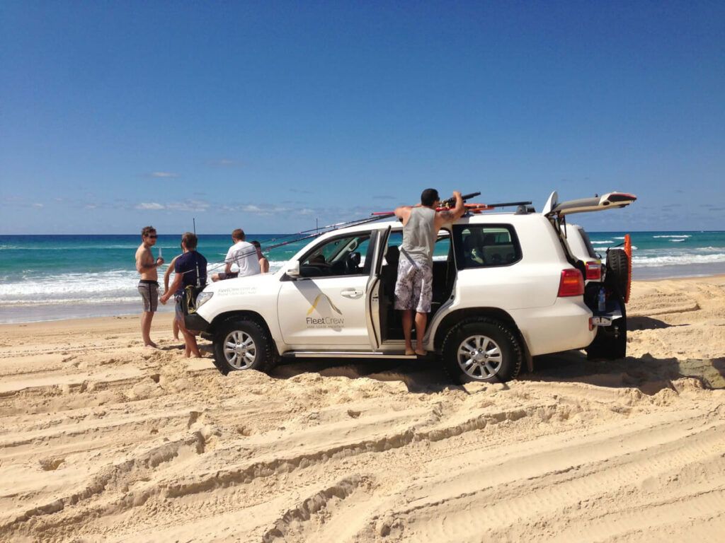 crew getting ready to surf w/ fleetcrew vehicle